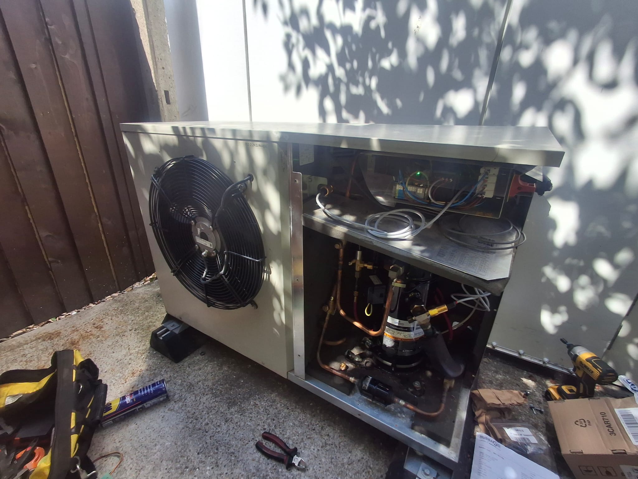 Open refrigeration condensing unit during repair and servicing